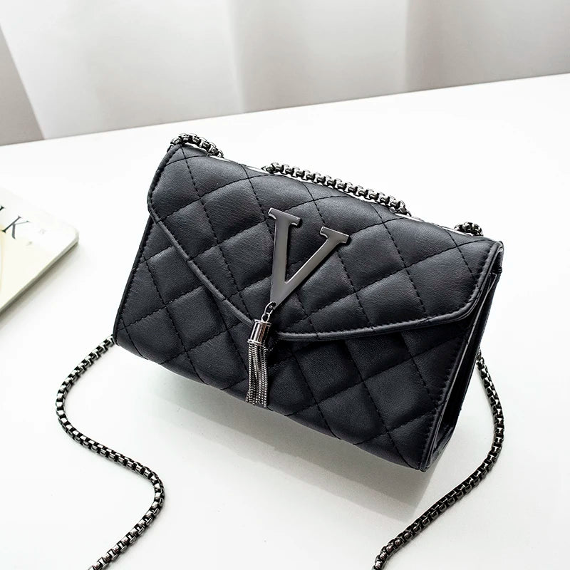 Shop Black Quilted PU Leather Crossbody Bag with Tassel