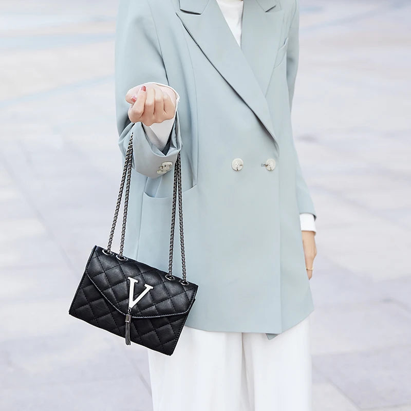 Shop Black Quilted PU Leather Crossbody Bag with Tassel