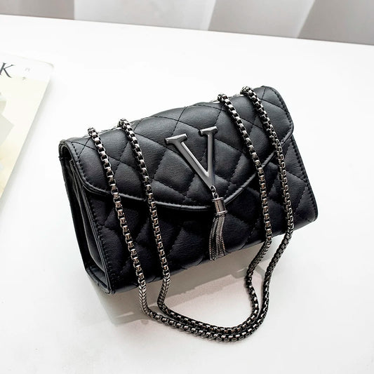 Shop Black Quilted PU Leather Crossbody Bag with Tassel